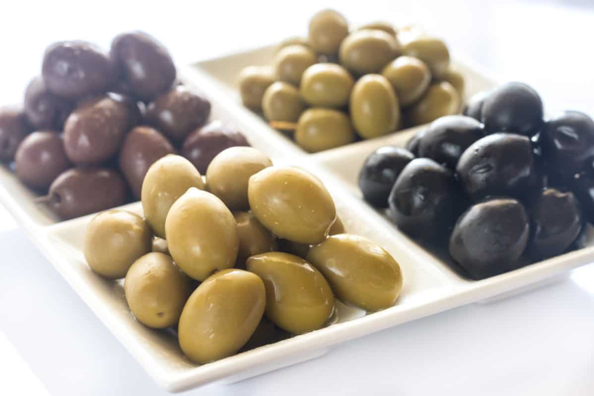 Multiple olive types placed on a platter