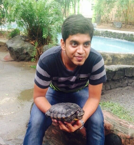 Adhithya with turtle in hand
